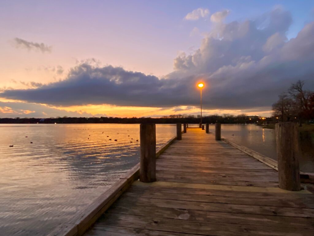 sunset at the lake and pier photo by Penny Sadler 2022